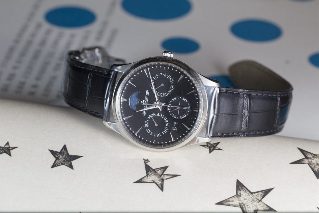 The male replica watches have black dials and black leather straps.